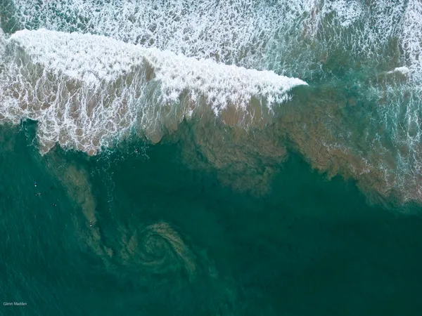 Surfers at 13th Beach